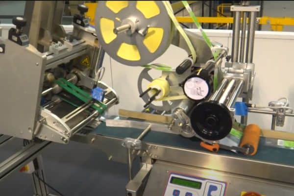 ELF-20 DESKTOP TOP FACE LABELLING MACHINE in action